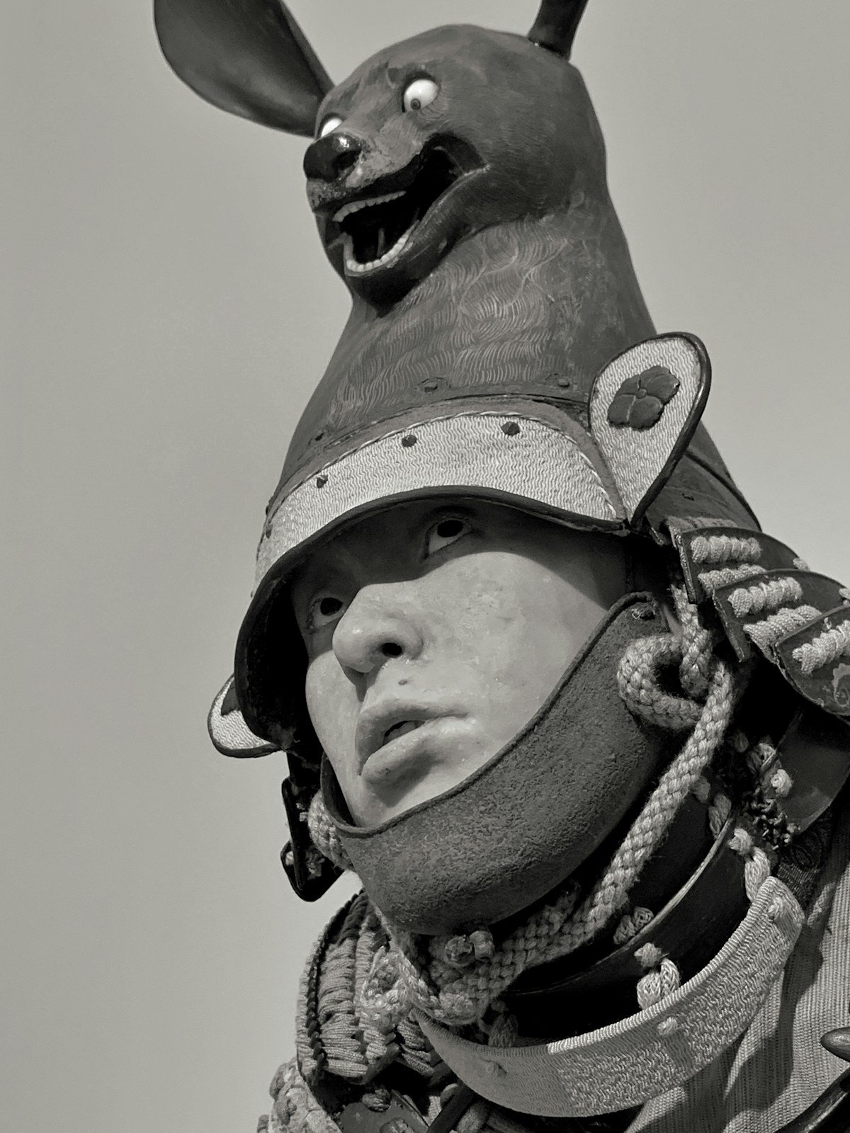 Participant in samurai armour holding katana during a samurai experience session in Tokyo, Japan