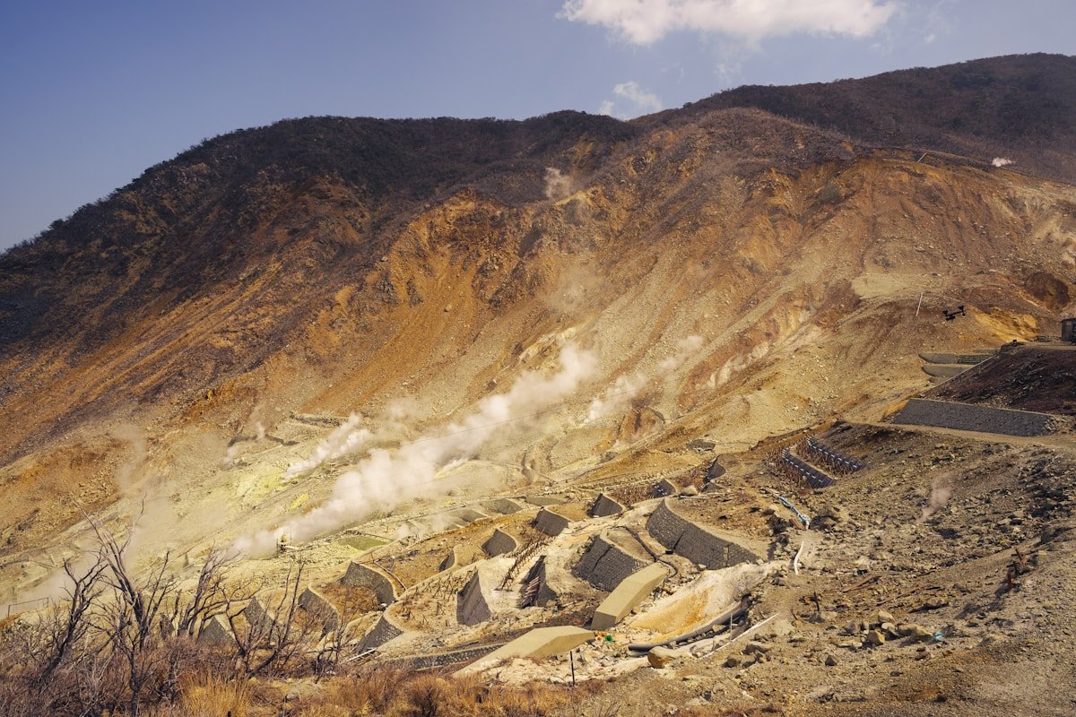 Owakudani volcanic valley with steaming sulfur vents and hiking paths, Hakone, Japan