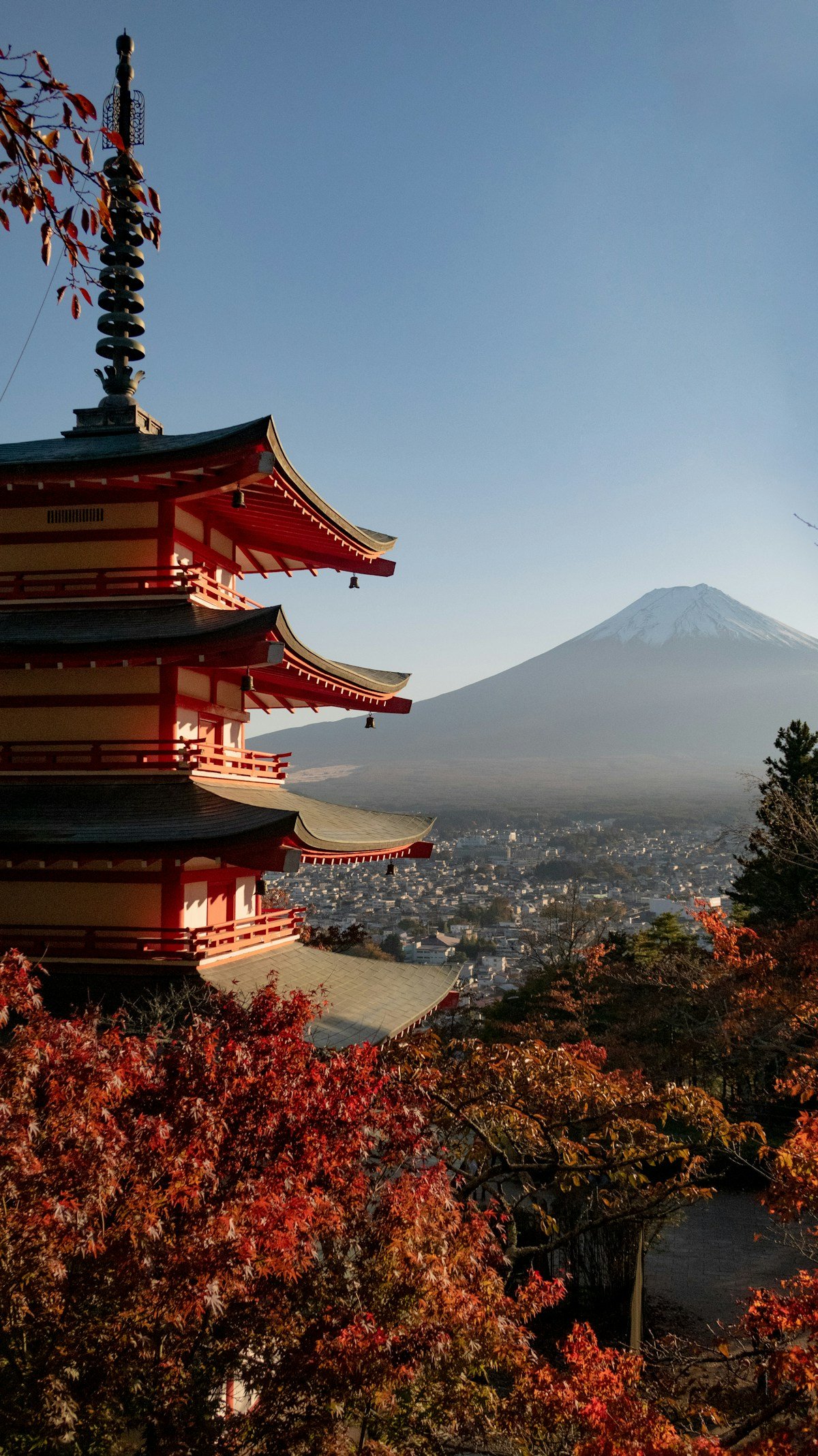 Chureito Pagoda with Mount Fuji rising behind it in autumn light