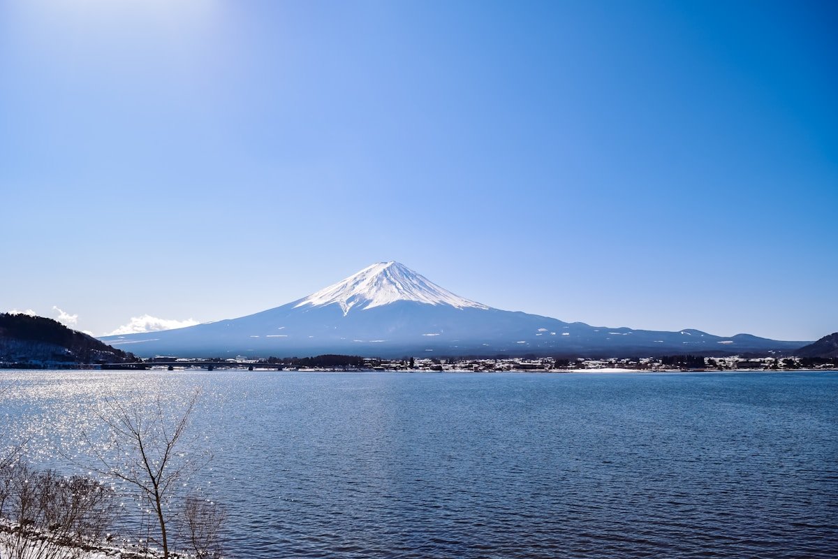Lake Kawaguchiko with Mount Fuji rising behind the water on a clear winter day
