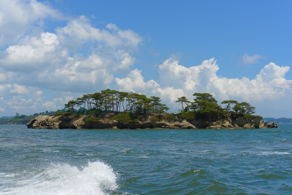 Pine-covered island in Matsushima Bay viewed from a boat, Miyagi Japan