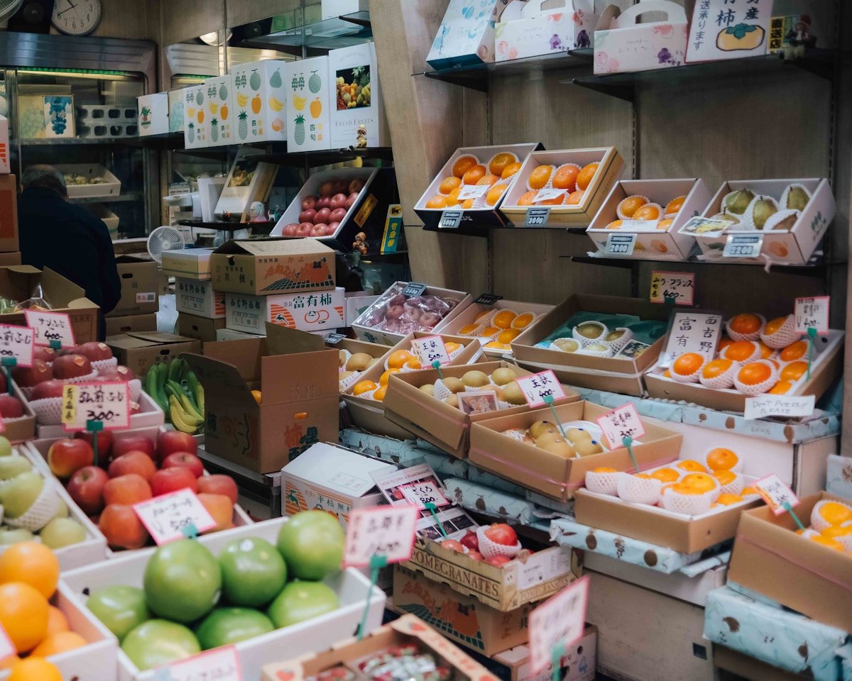 Fresh fruits and local produce displayed in a Japanese market in Ehime