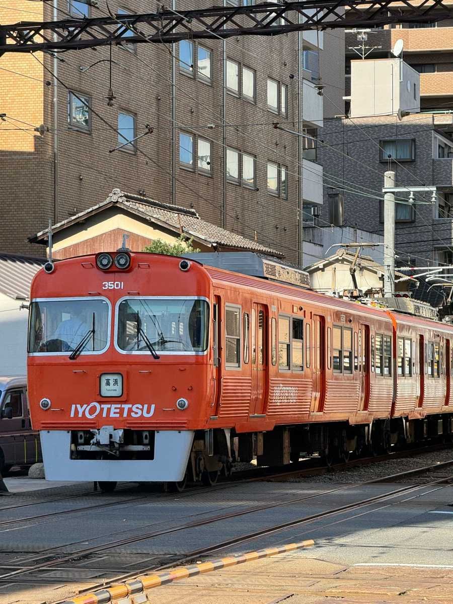 Orange Iyotetsu city train in Matsuyama, Ehime