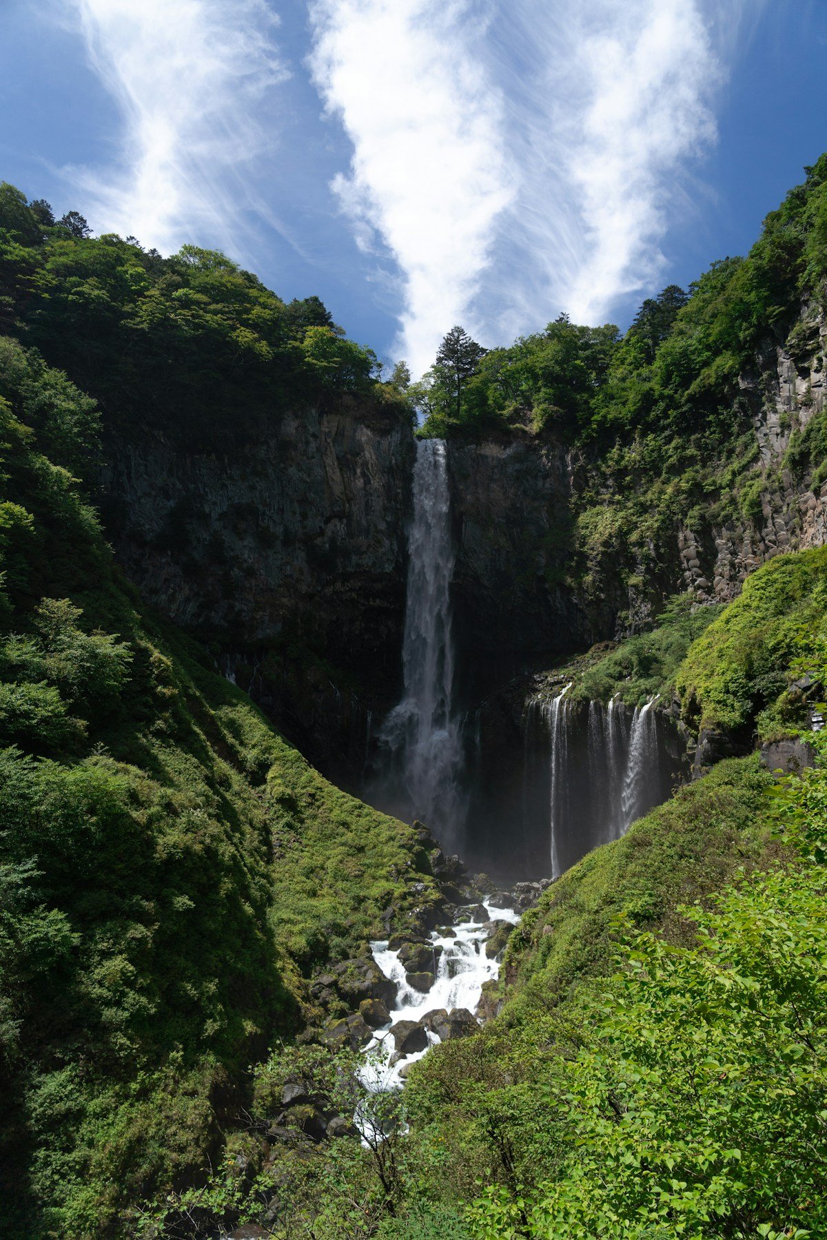 Kegon Falls waterfall cascading through a green valley in Nikko, Tochigi Japan