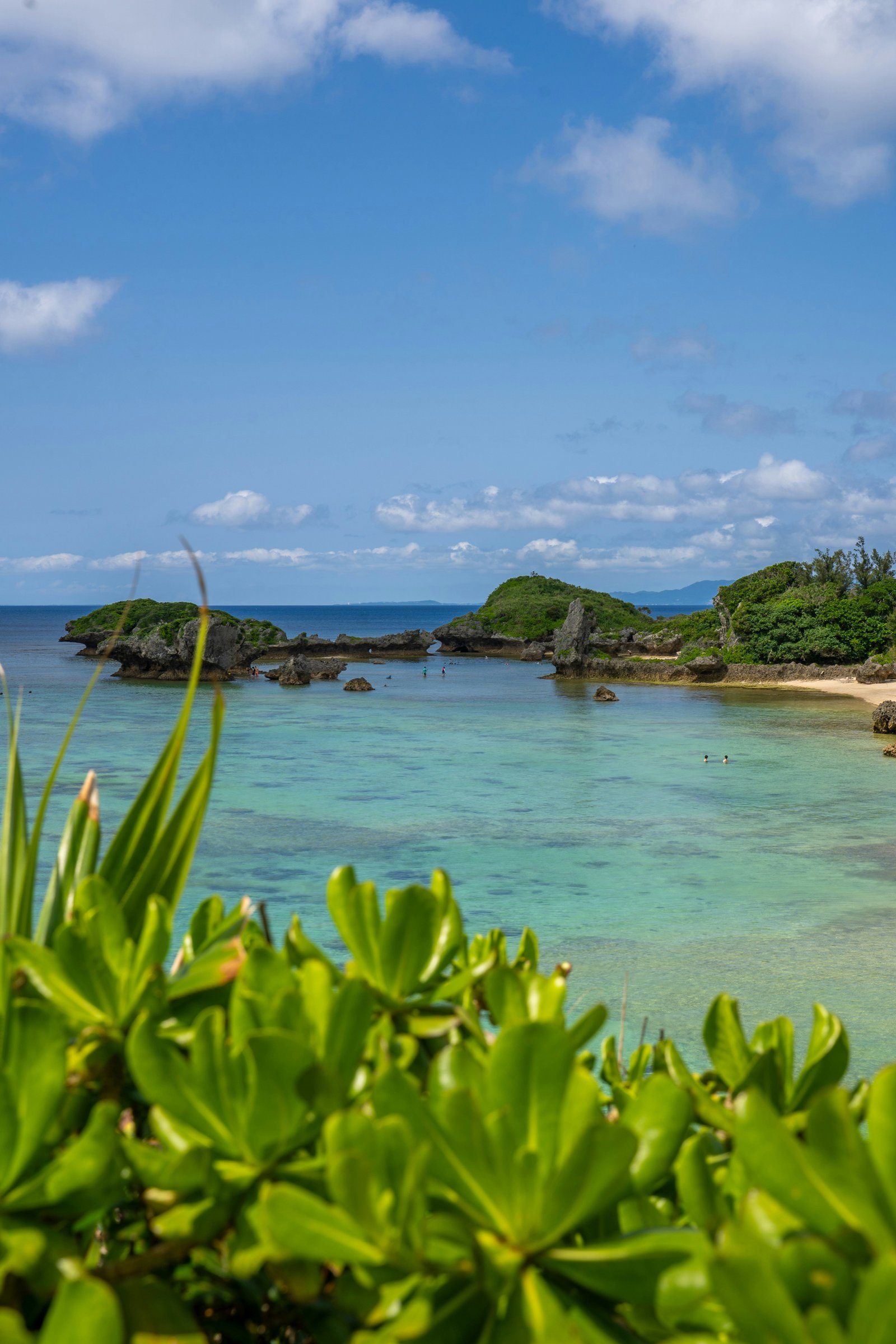 Turquoise waters and limestone rocks of the Okinawa coastline