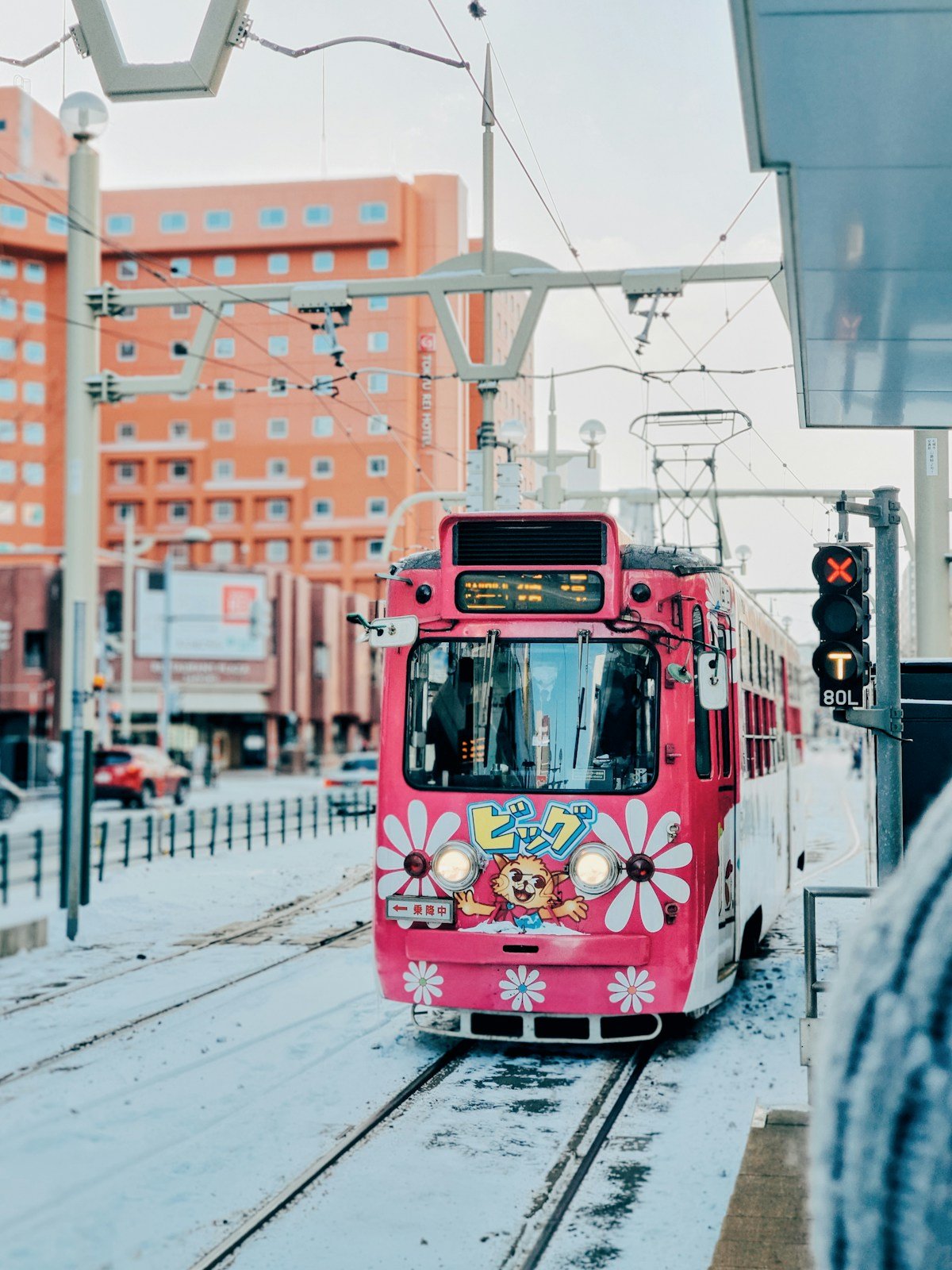 Sapporo, Japan — a tram on a snow-covered street in the city centre