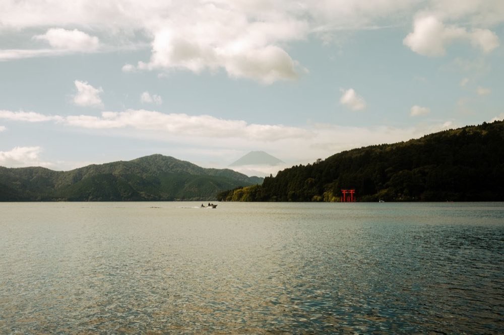 Lake Ashi with the red torii of Hakone Shrine and Mount Fuji in the distance