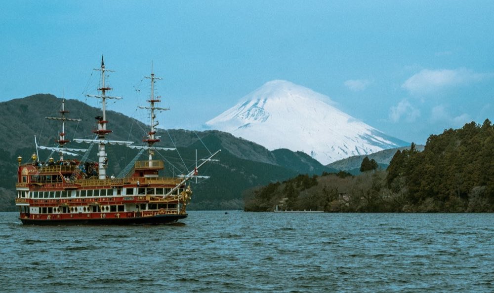 Hakone sightseeing pirate ship on Lake Ashi with snow-capped Mount Fuji behind