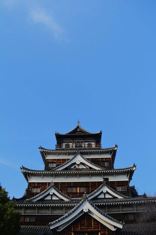 Hiroshima Castle keep against a clear blue sky
