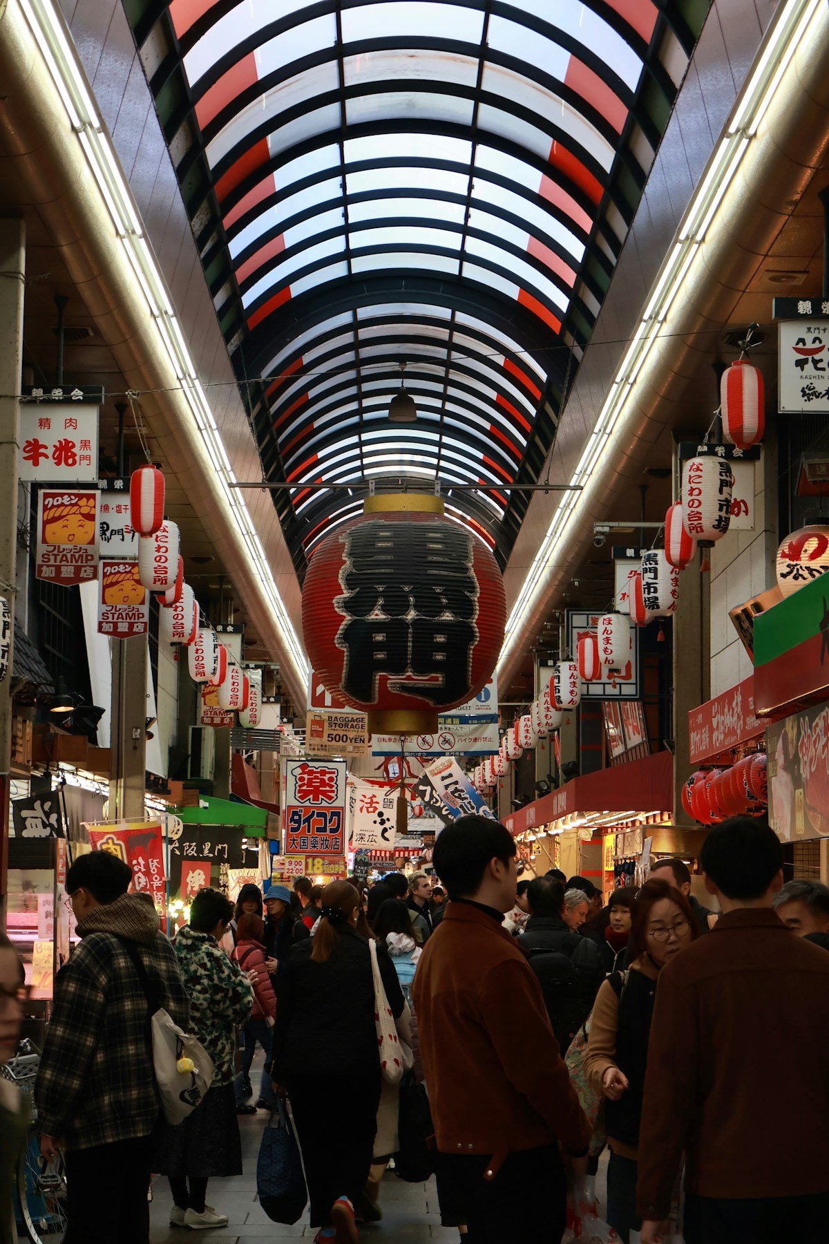 Covered Japanese market with vendors and lanterns — Kanazawa Omicho food market