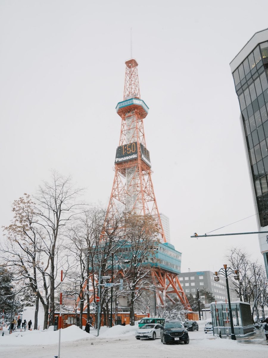 Sapporo TV Tower rising above a snowy street