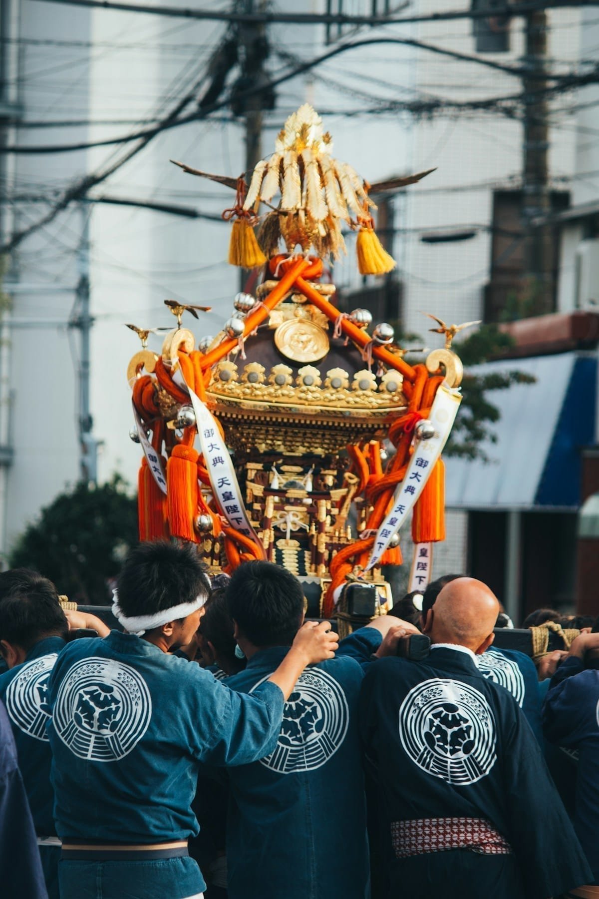 Lanterns lit up at a traditional Japanese summer festival with yukata-clad crowds