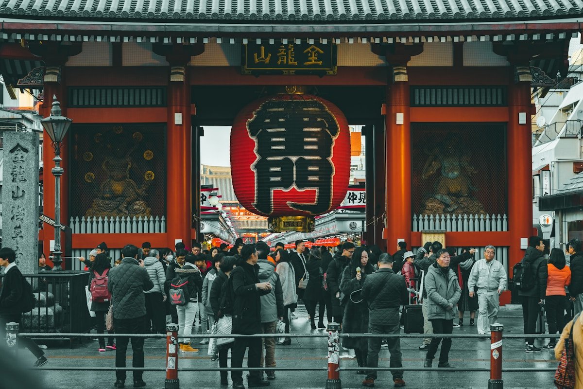 Crowds gathered in front of the Kaminarimon gate at Sensoji Temple, Tokyo, Japan