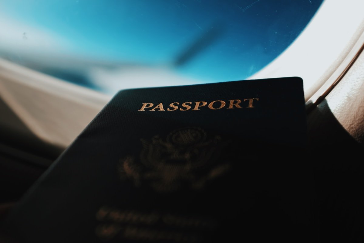 Passport booklet on white surface with airplane boarding pass — Japan ETA JESTA travel authorisation guide