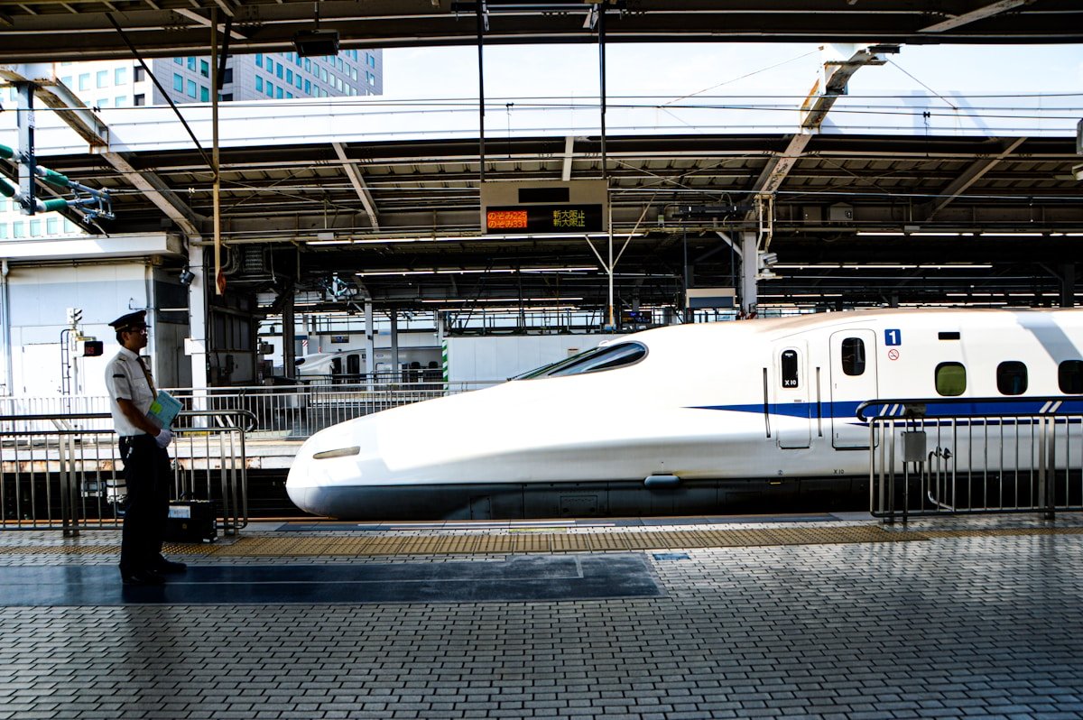 White bullet train at station platform — Narita airport transfer guide
