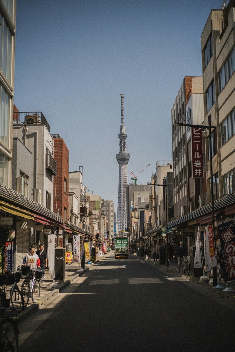 Tokyo street leading toward the Skytree tower — solo travel in Japan