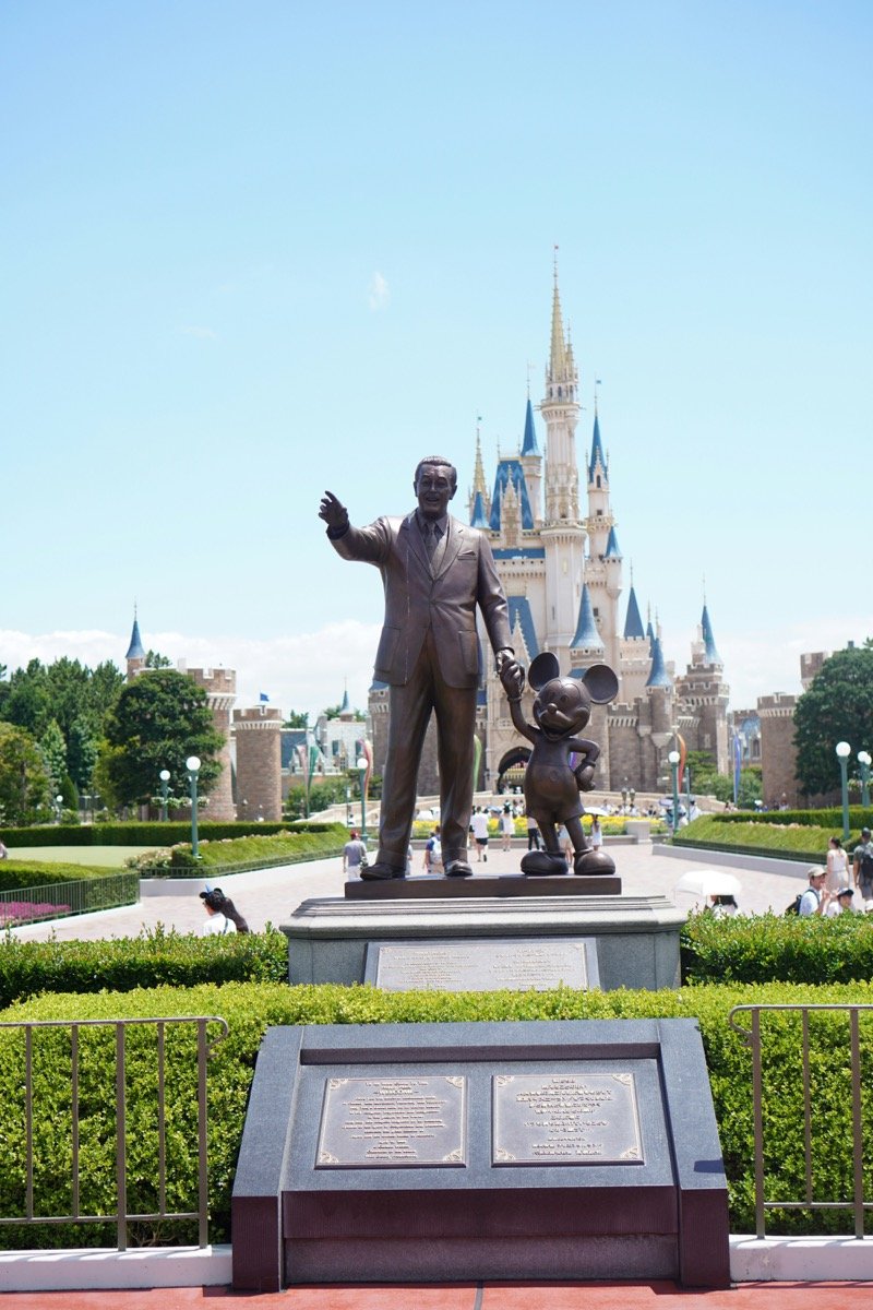 Walt Disney and Mickey Mouse statue in front of Cinderella Castle at Tokyo Disneyland