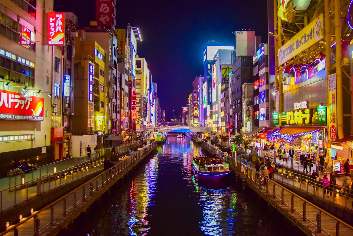 Dotonbori canal at night with neon lights — best tours in Osaka